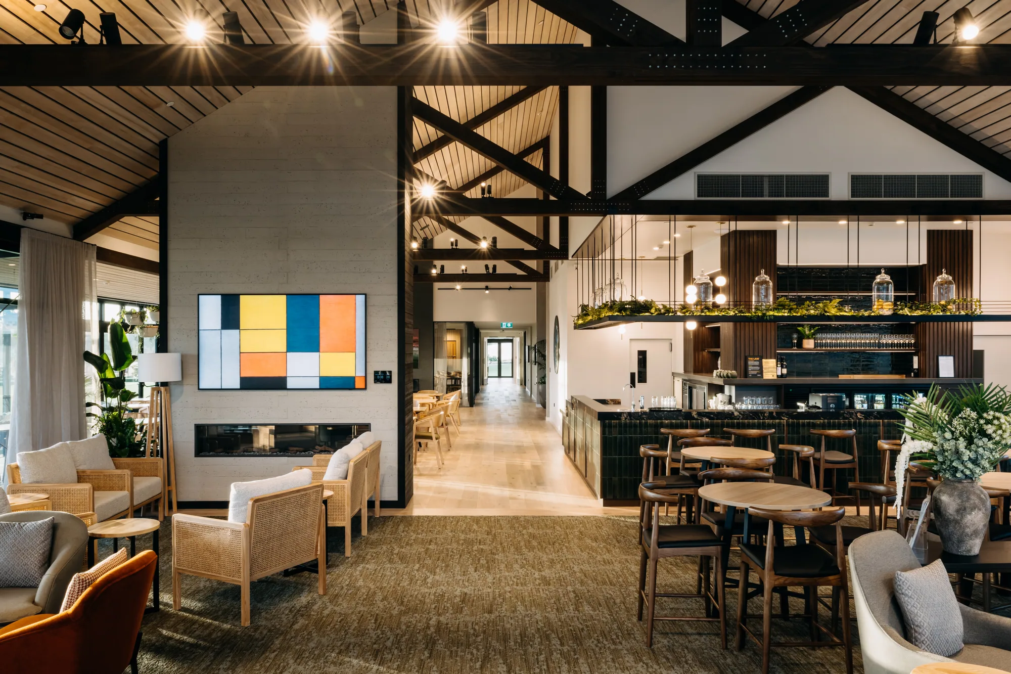 Wide view of the Arvida Te Puna Wairoa clubhouse bar, lounge and exposed timber structure