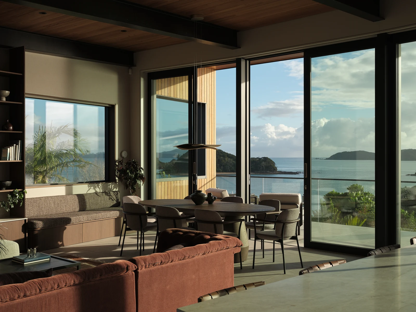Morning sun on the window seat and dining area seen from the kitchen