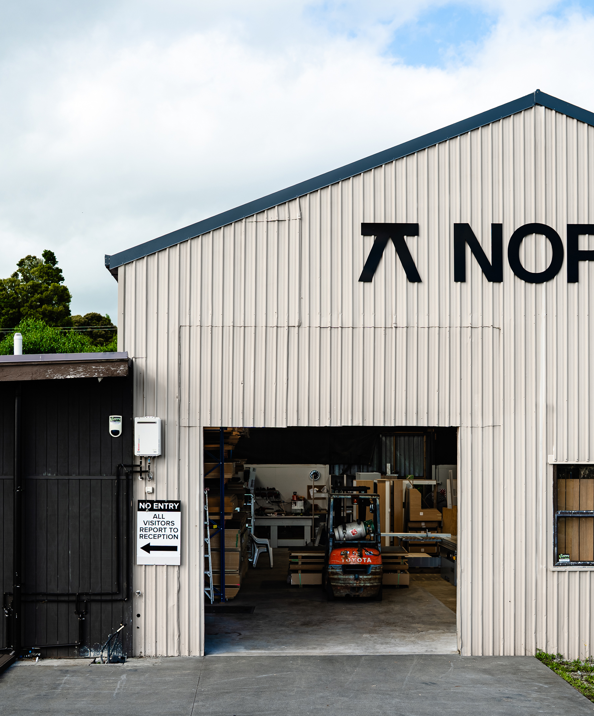 North Interiors Kerikeri workshop exterior with the manufacturing entrance open