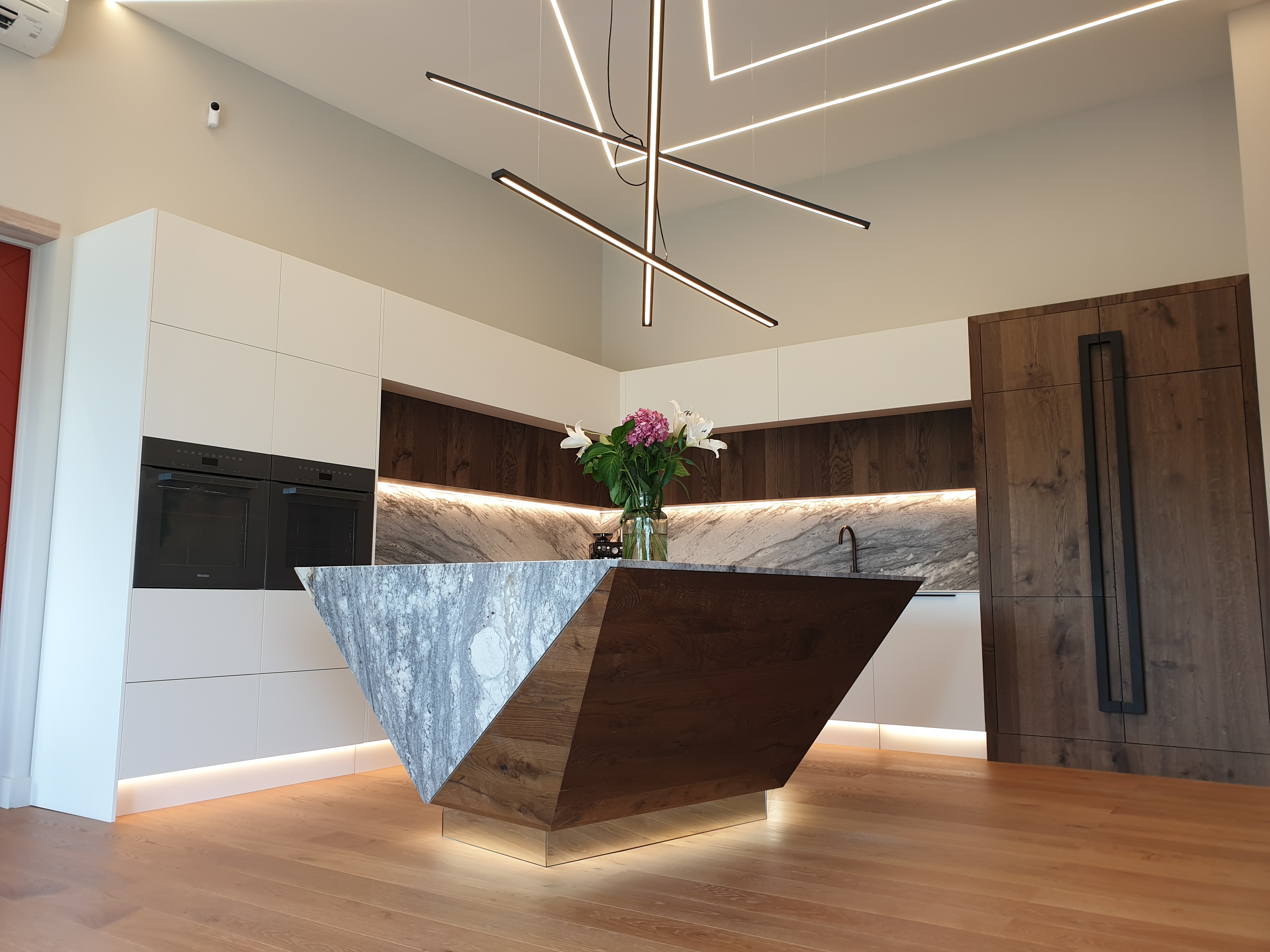 North Interiors Kerikeri showroom kitchen with sculptural stone and timber island