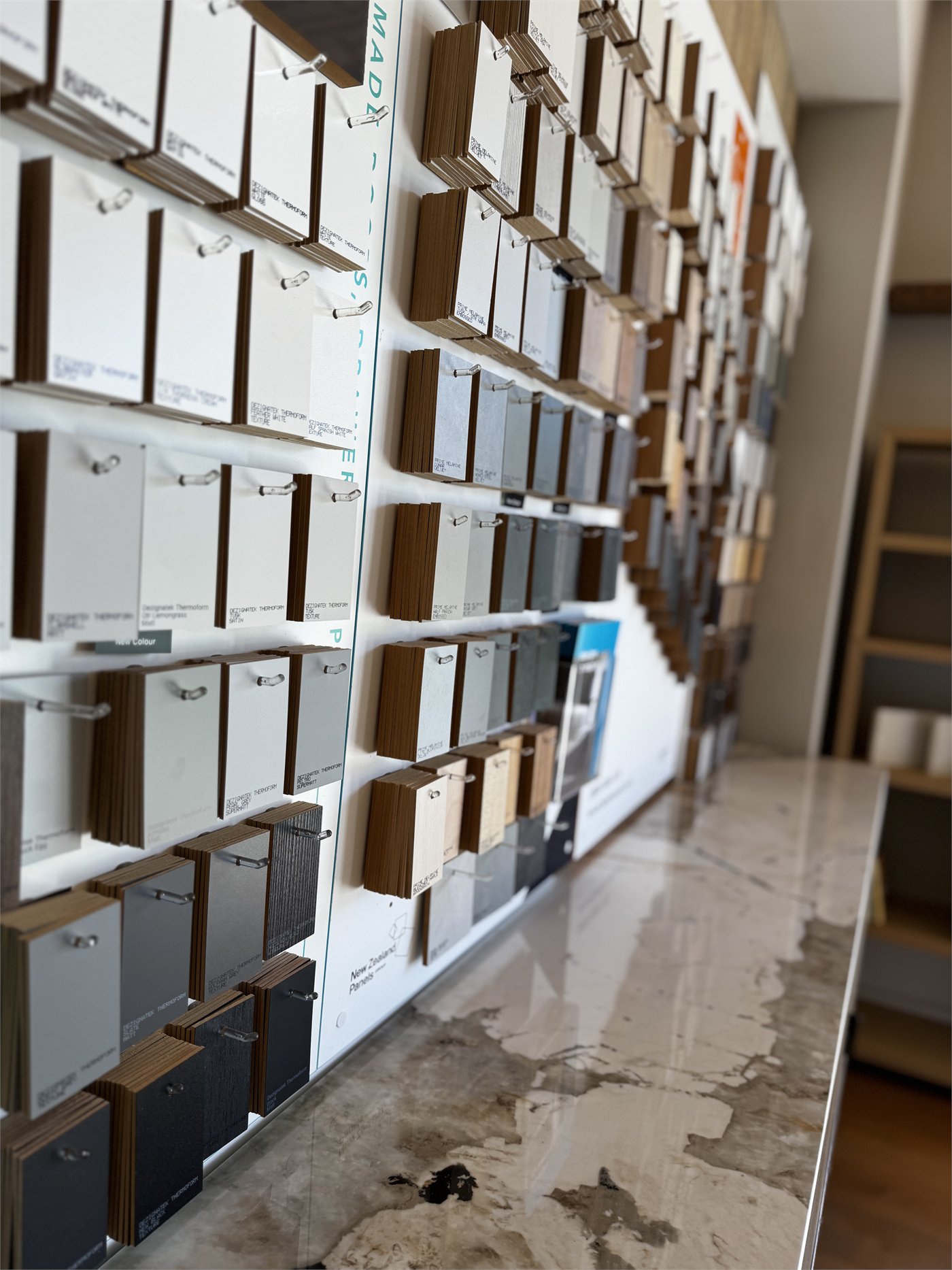Wall-to-wall cabinetry finish samples in the North Interiors Kerikeri showroom